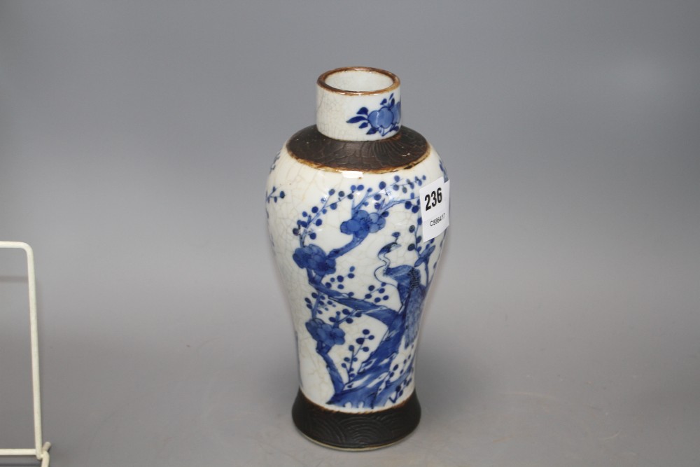 A Chinese crackle glaze baluster vase, decorated with peacocks and prunus blossom, height 25.5cm